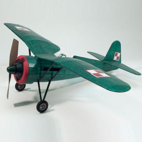 Dumas Gummimotorflugzeug im Retro-Design mit grüner Lackierung und Propeller, seitliche Ansicht.