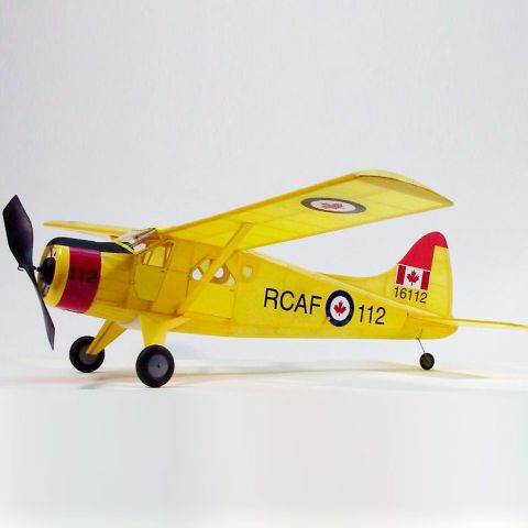 Dumas Gummimotorflugzeug RCAF Modell in Gelb mit Propeller und kanadischen Markierungen, seitliche Ansicht.